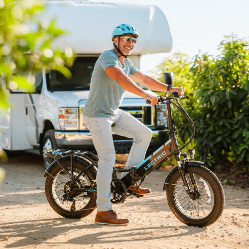 man riding his Lectric bikes in from of his RV