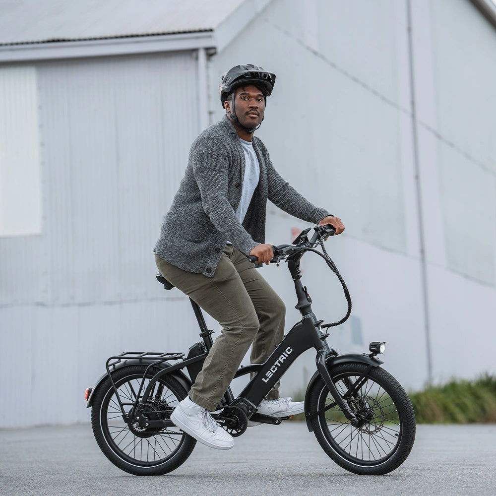 man zooming down road on lectric ONE commuting eBike