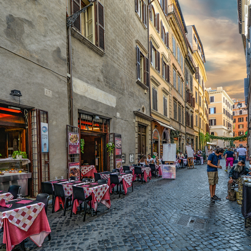 An Italian Street with people and cafe