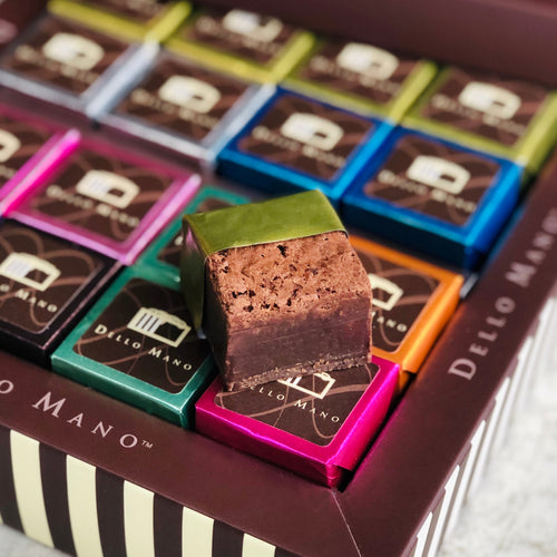 A Dello Mano gift box of individually foil wrapped brownies