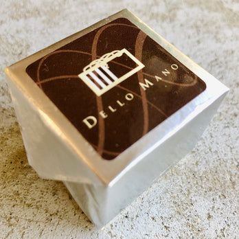 A Dello Mano Luxury Espresso Walnut  Brownie Cube wrapped in  silver efoil