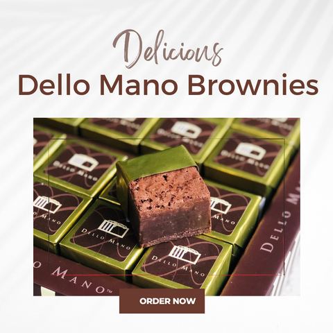 A Dello Mano Brownie Gift Box with an open brownie and the words Delicious Dello Mano Brownies
