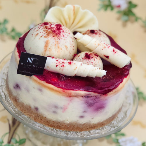 White Chocolate Raspberry Cheesecake with white handmade decoration