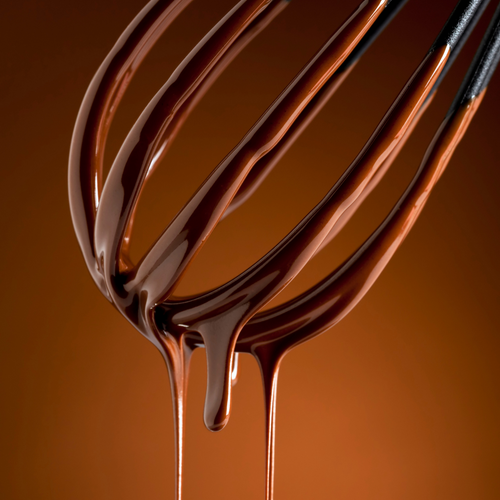 Chocolate dripping from whisk