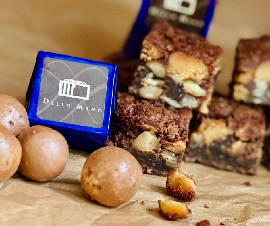 macadamia brownie with open brownies and nuts.png__PID:659d90b3-d79c-475f-8c3b-6052a9cdc533