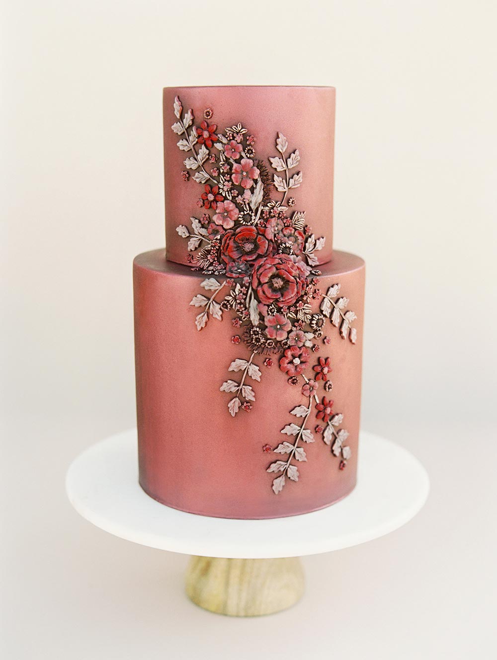 metallic burgundy wedding cake with sugar flowers