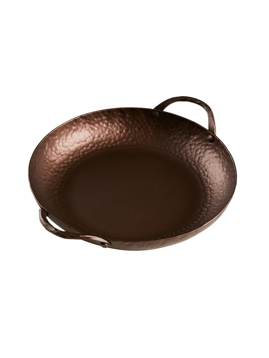 https://cdn.shopify.com/s/files/1/0229/5480/3236/files/Smithey-Hand-Forged-Carbon-Steel-Round-Roasting-Pan-Weston-Table-SP2.jpg?v=1696525252&width=533