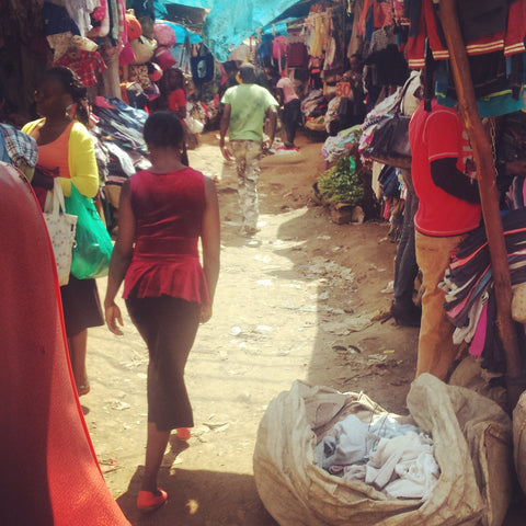 A Kenyan walking through Toi Market