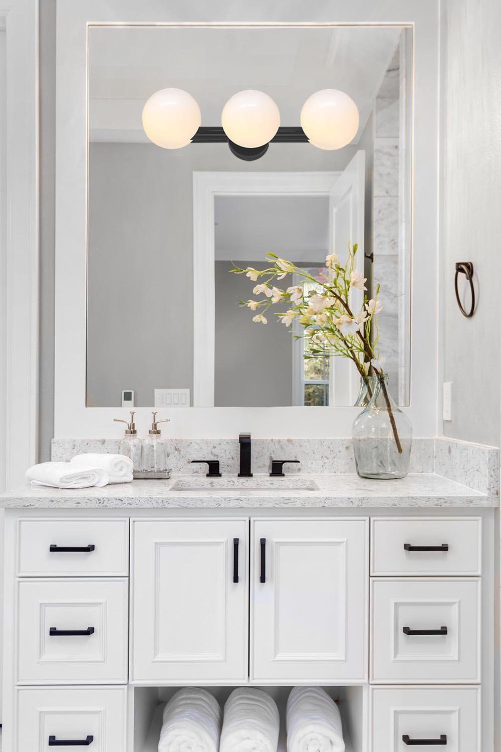 triple sconce bathroom