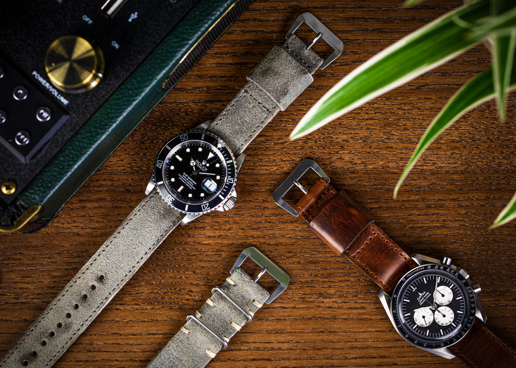 Single pass nato straps in grey tasso and distressed brown leather on a Rolex and Omega watch
