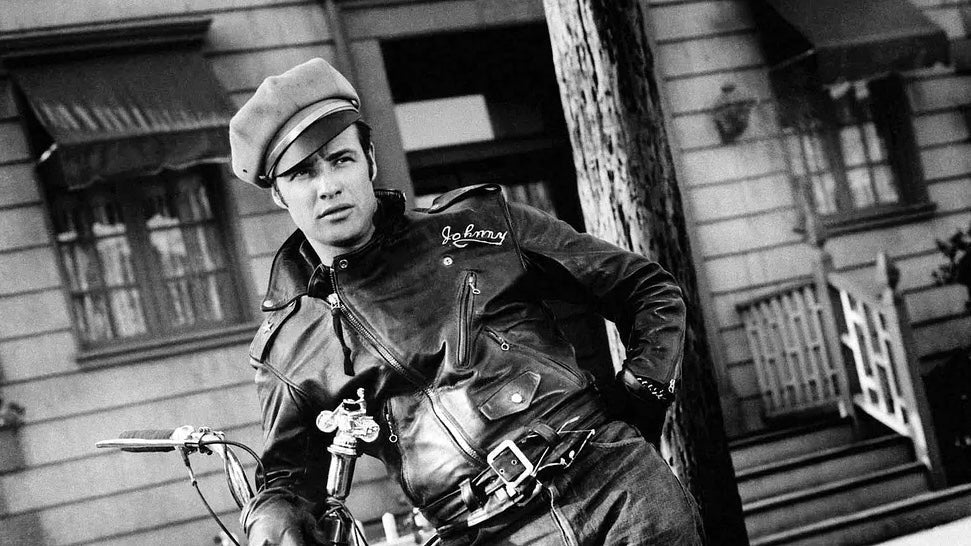 Marlon Brando on a motorcycle wearing a black leather jacket