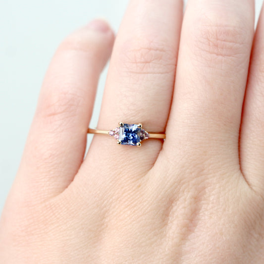 Imogene Ring with a 0.78 Carat Cornflower Blue Radiant Cut Sapphire and Berry Sapphire Accents in 14k Yellow Gold - Ready to Size and Ship - Midwinter Co. Alternative Bridal Rings and Modern Fine Jewelry