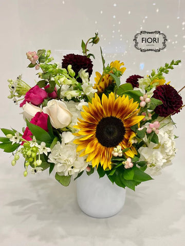 cinnamon sugar flower arrangement in white vase