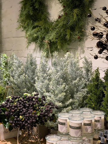 Christmas Market in FIORI Oakville Flower Store Showing Candles and Mini Trees