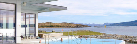 Outdoor pool with views overlooking a loch