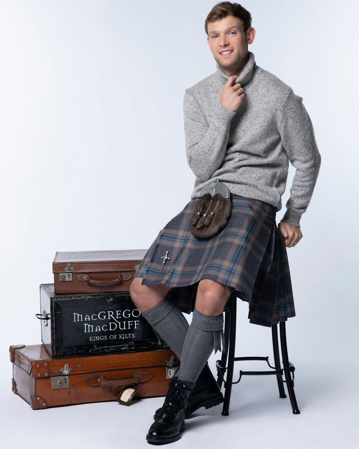 Man wearing a kilt with a jumper