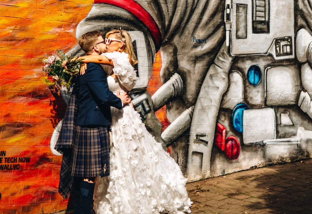 Bride and groom wearing kilt