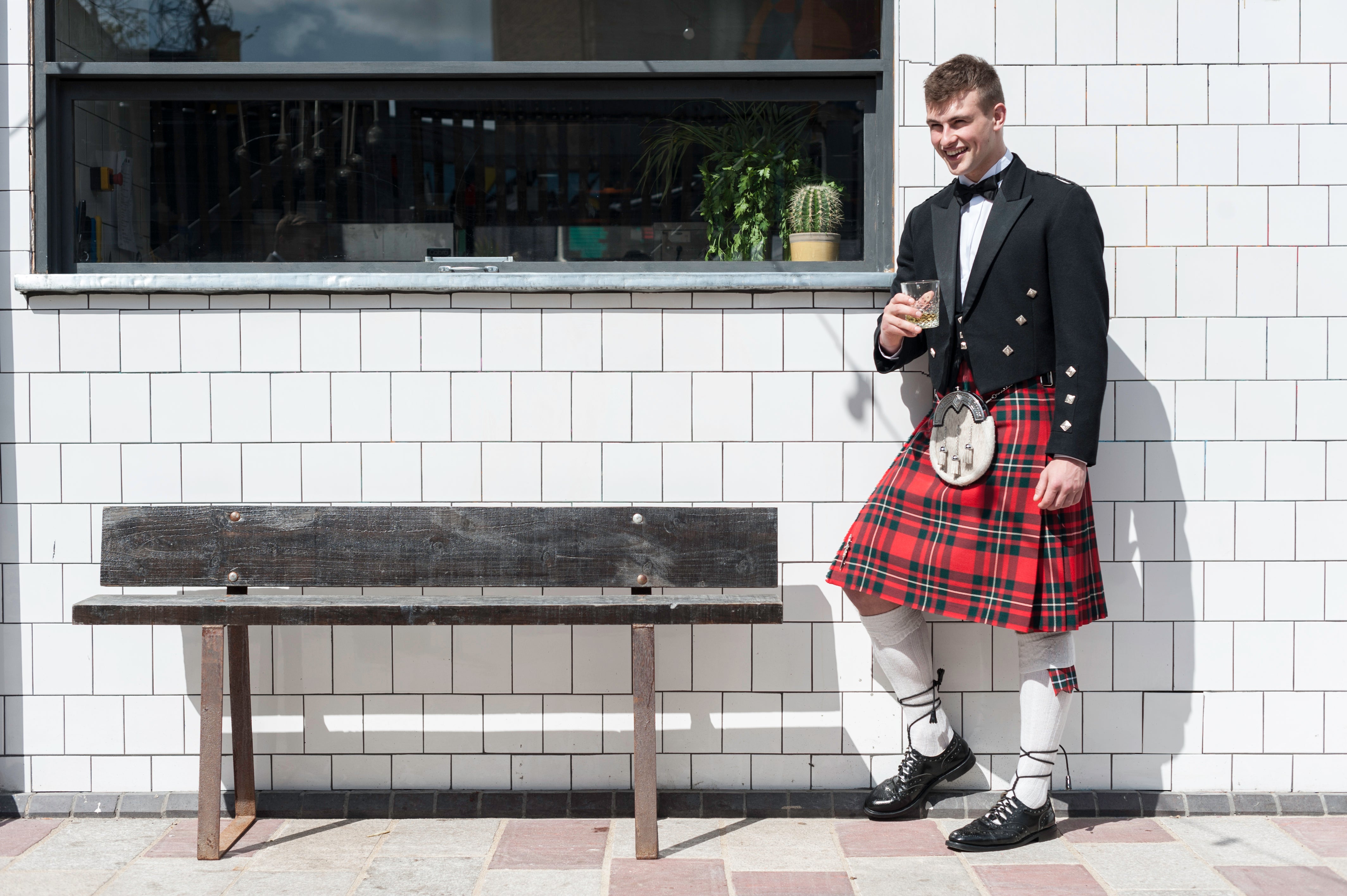 man in prince charlie kilt outfit