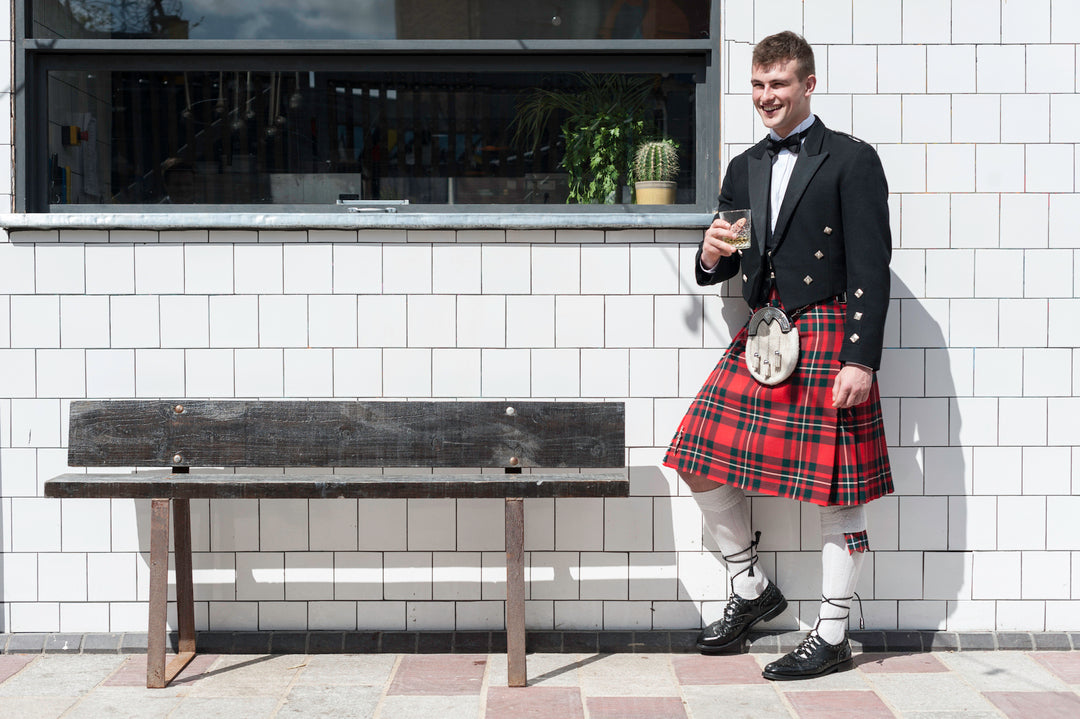 man wearing a price charlie kilt outfit