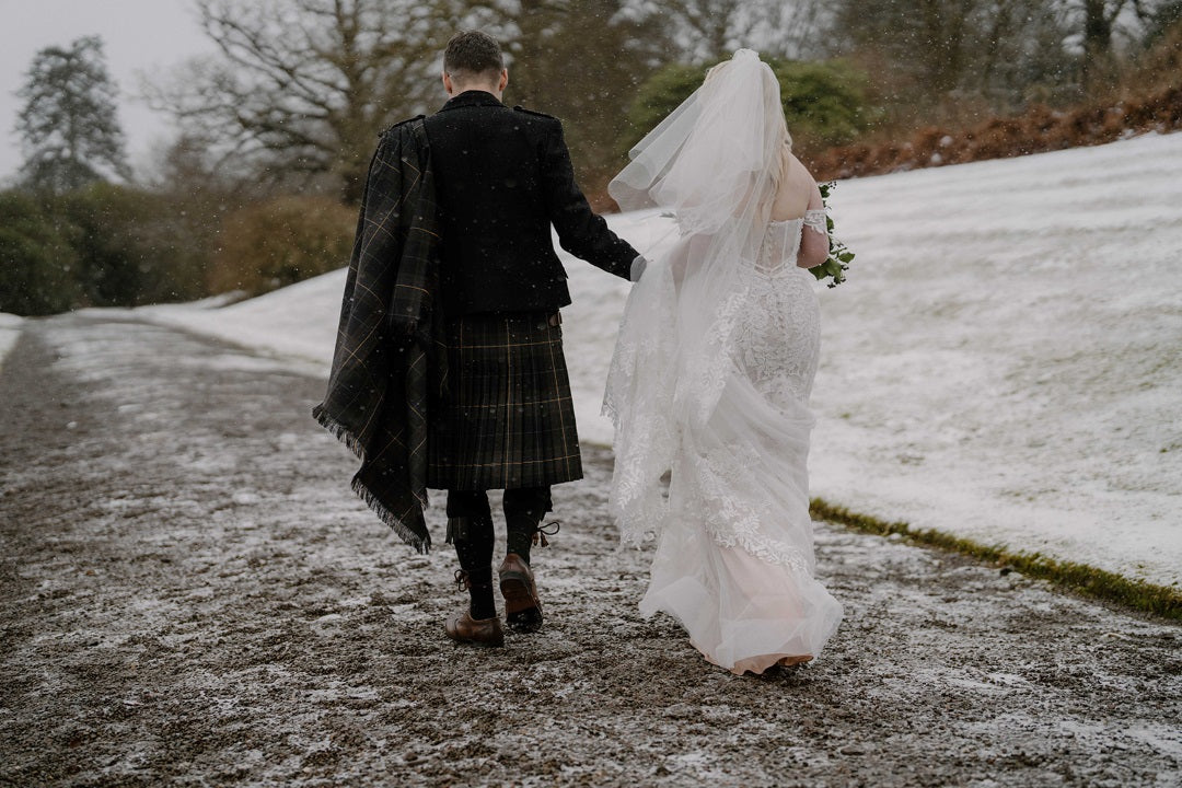 Groom wearing tartan plaid