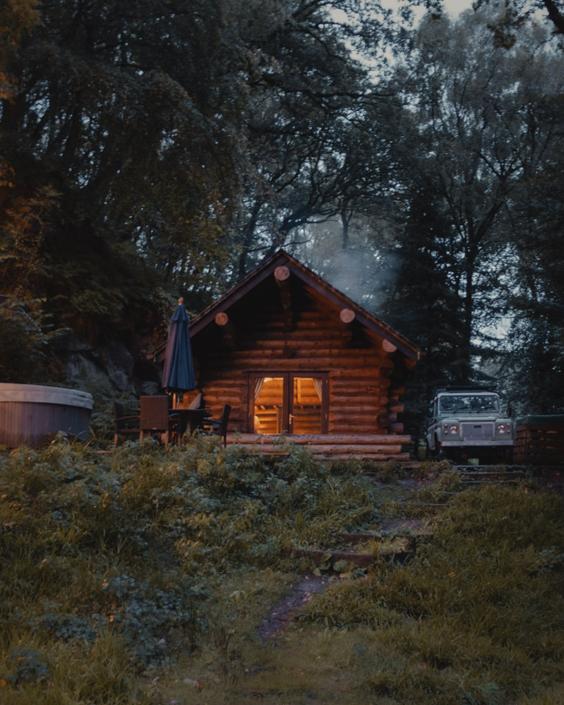 Cosy log cabin at night