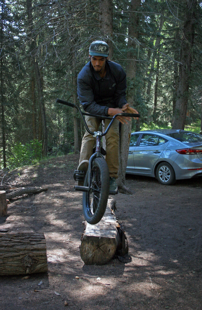 Devin Burks Log Bar Spin at Campsite. Photo Credit: Preston Levi