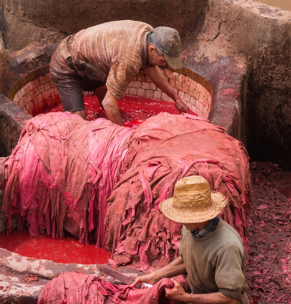 Textile workers dyeing fabric
