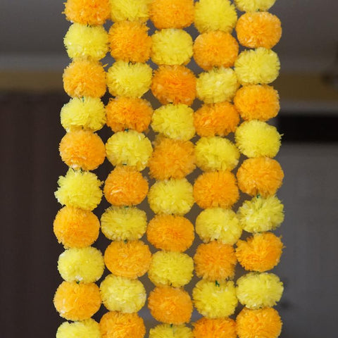 orange yellow marigold decoration garlands from aangan of india;  These party decoration garlands are perfect for Diwali, halloween, day of the dead and Fall wedding.  Perfect for Indian and American theme weddings and events