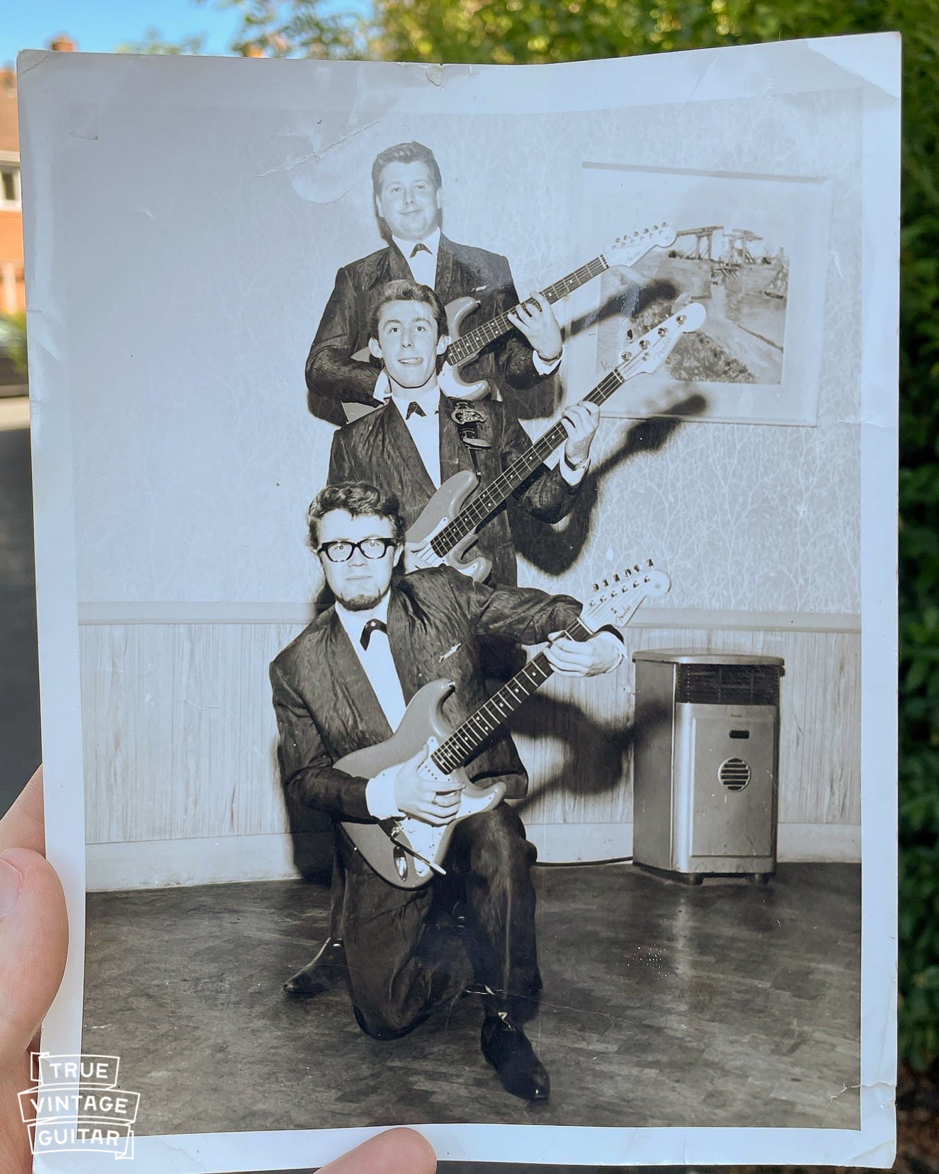 Photo of London, UK based band The Strollers with matching 1962 Fender Stratocasters and Precision Bass guitars