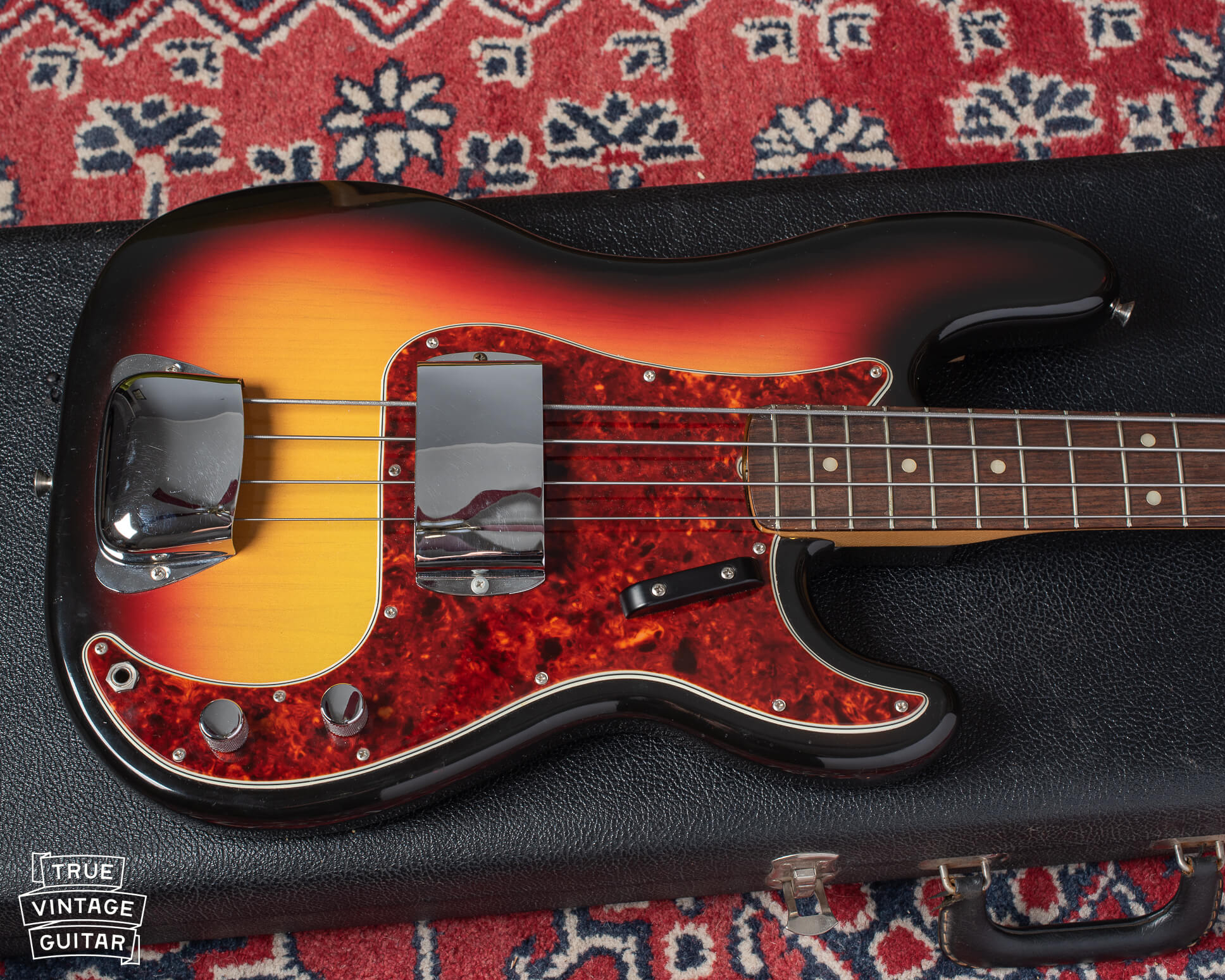 Sunburst finish with red tortoiseshell pickguard on 1966 Fender Precision Bass
