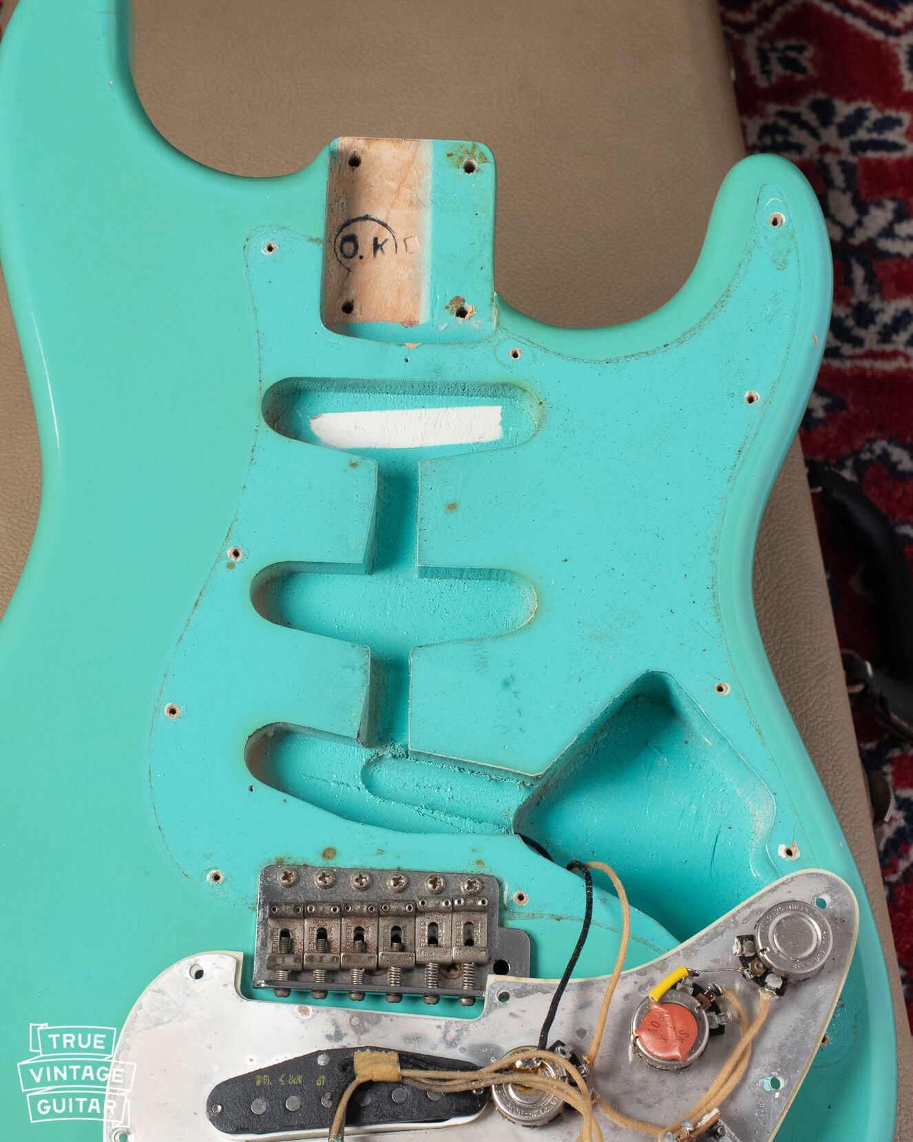 Vintage Fender Stratocaster custom color identification with cavity edges, nail holes, white undercoat, and neck pocket with OK stamp