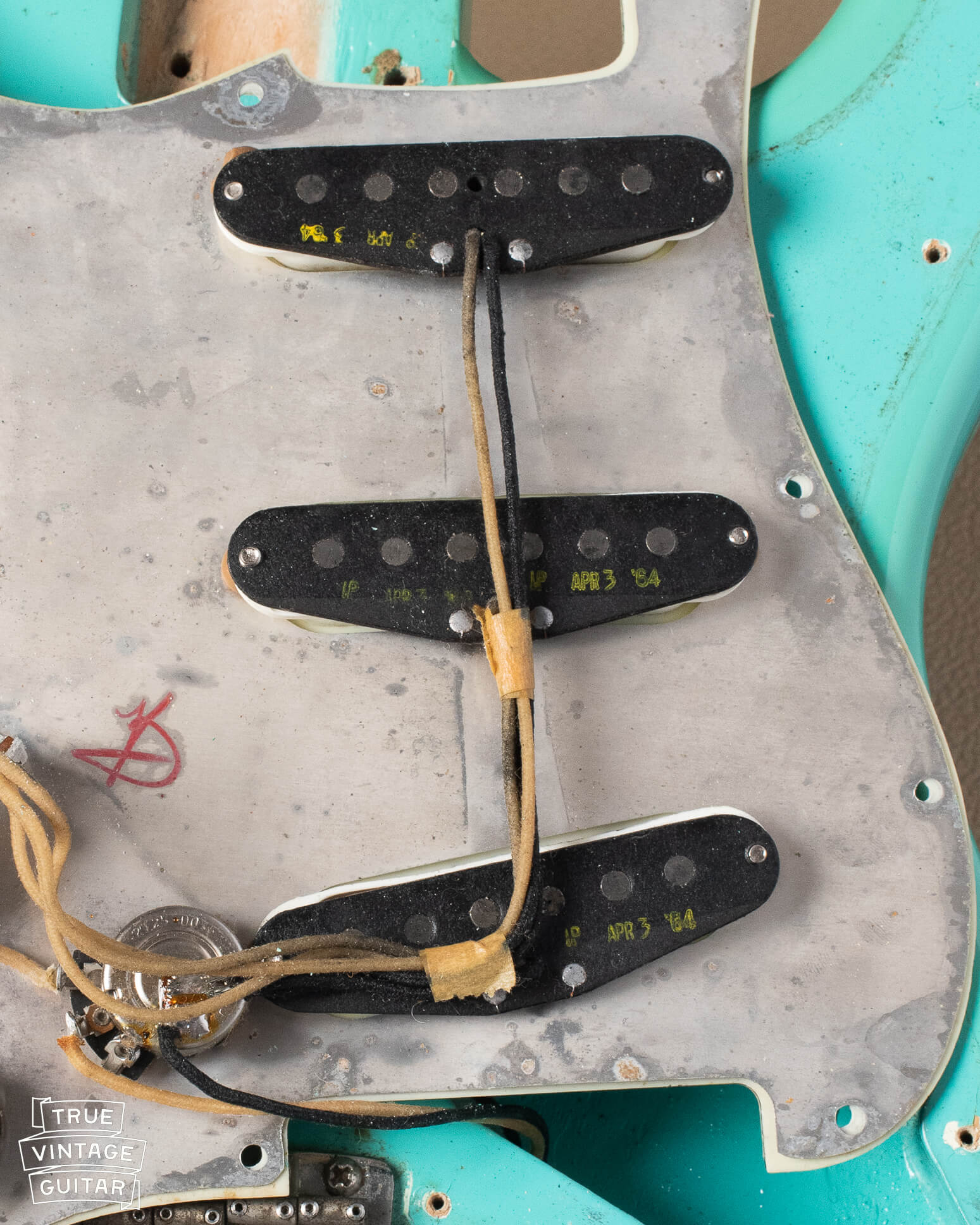 Black bobbin pickups with yellow ink stamp from 1964 Stratocaster