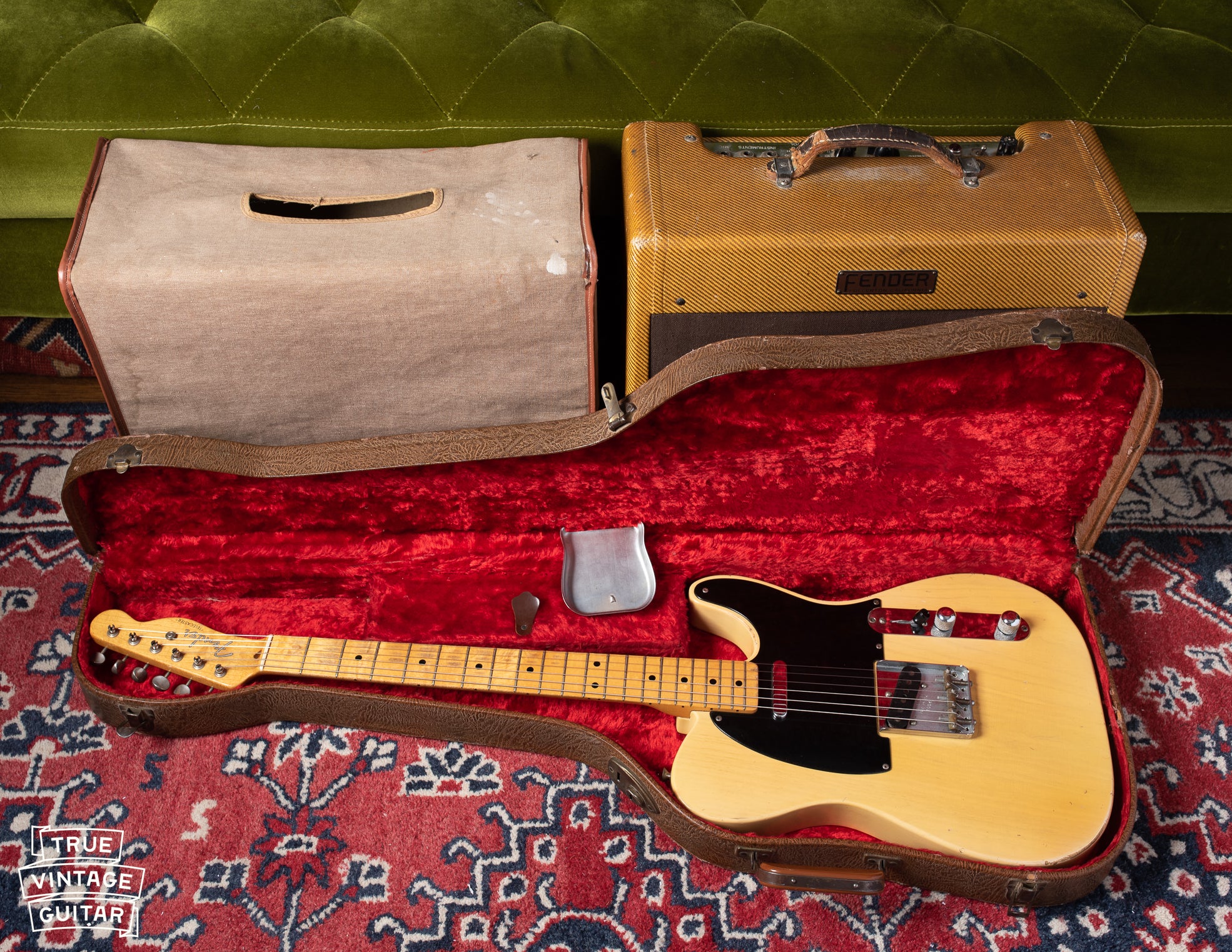 1953 Fender Telecaster with black pickguard, brown form fit case, and Deluxe amp with tweed covering