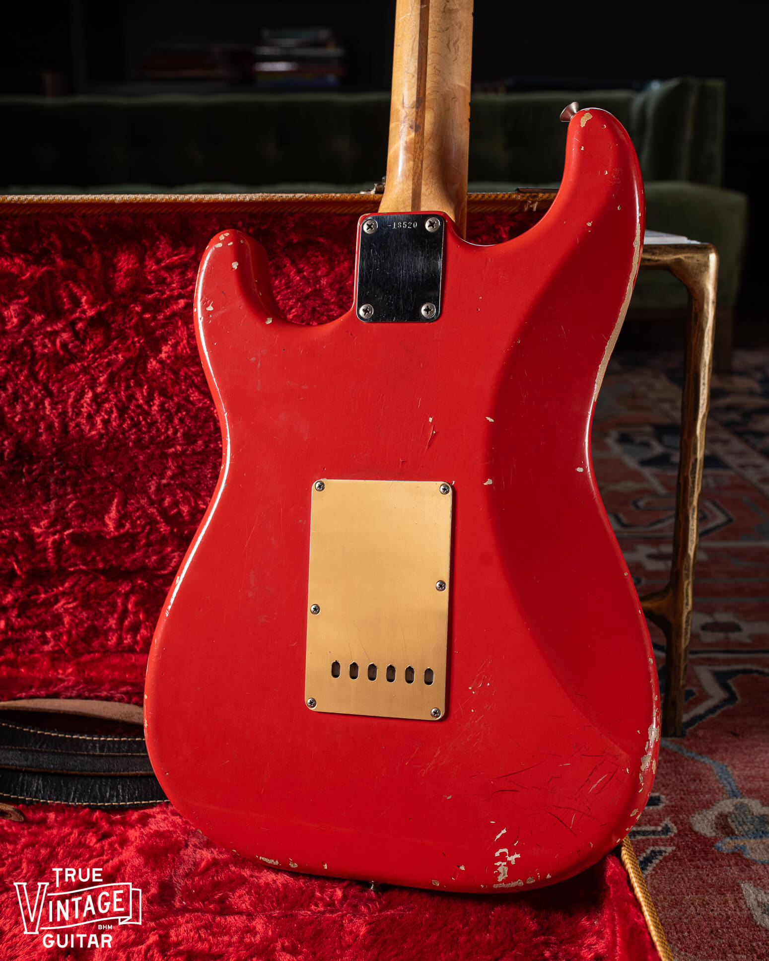 Gold anodized aluminum tremolo cover plate on 1957 Fender Stratocaster Red