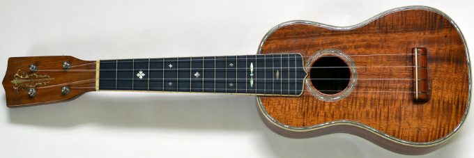 vintage Martin made Ditson ukulele with fancy inlay, dreadnought body shape. 