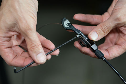 image showing an allen wrench being used to tighten cable fixing bolt on a Wolf Tooth remote