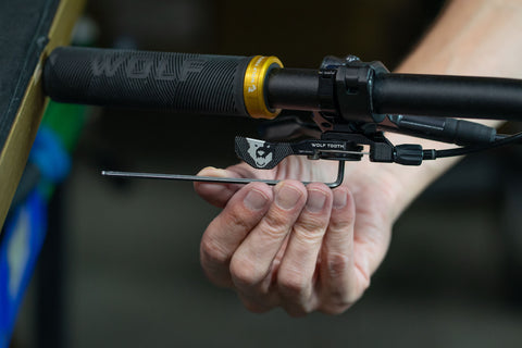 image showing hex wrench being used to tighten handlebar clamp bolt on ReMote