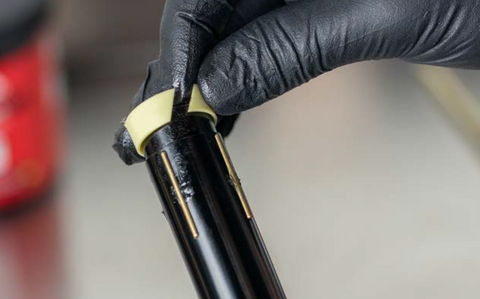 image showing split bushing being installed with gloved hands