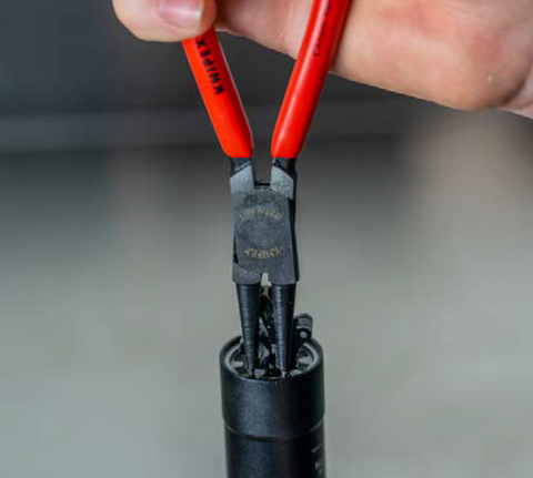 image showing snap ring pliers installing snap ring