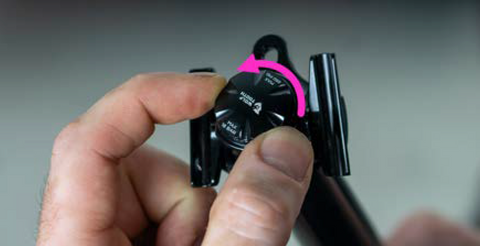 image showing fingers twisting the air cap to remove it