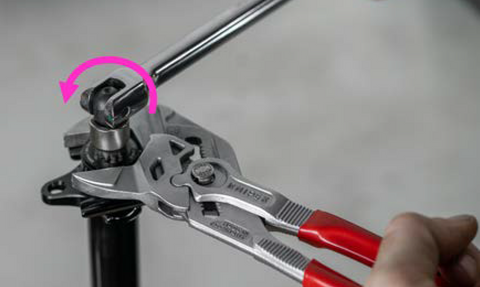 image showing Knipex and socket to remove the lockring