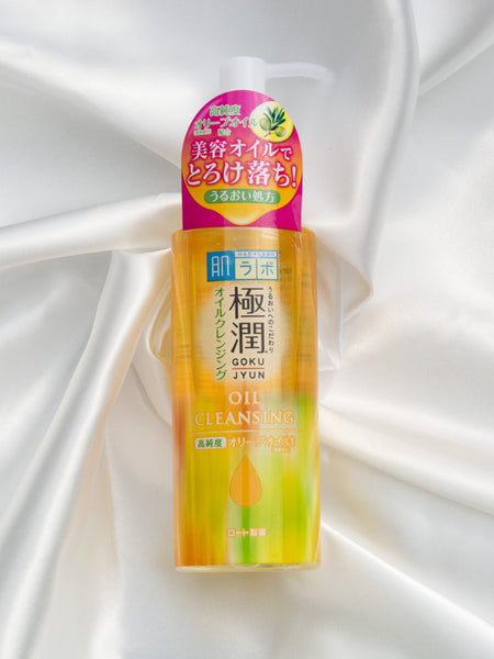 Hada Labo Gokujyun Cleansing Oil  japanese cleanser cleansing oil product lying on a white cloth stylish lifestyle photo high quality product review 肌ラボオイルクレンジング
