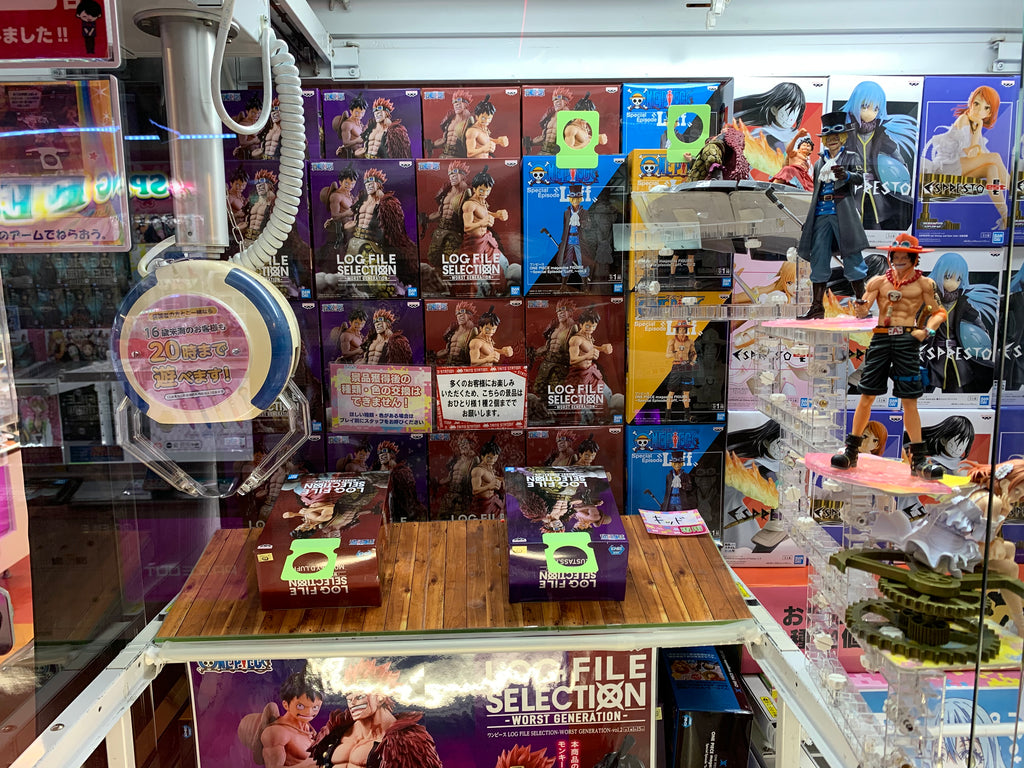 Japanese crane game in game arcade with Once Piece animation action figure in Japan