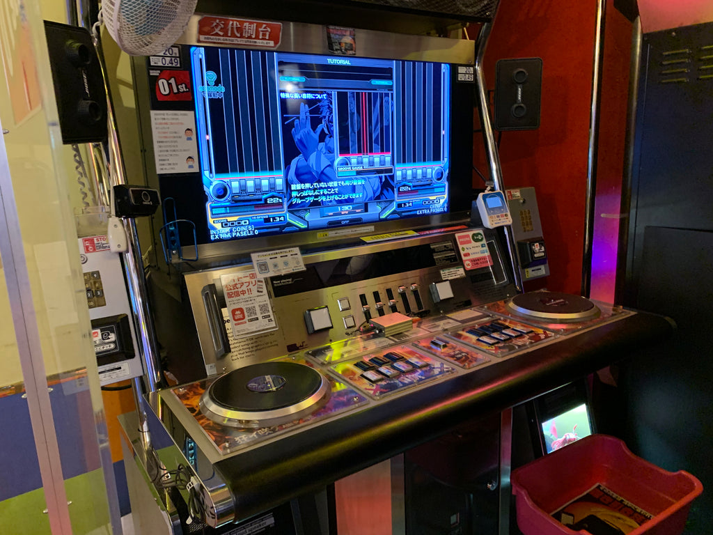 Japanese DJ booth rhythm music game in game arcade in Japan