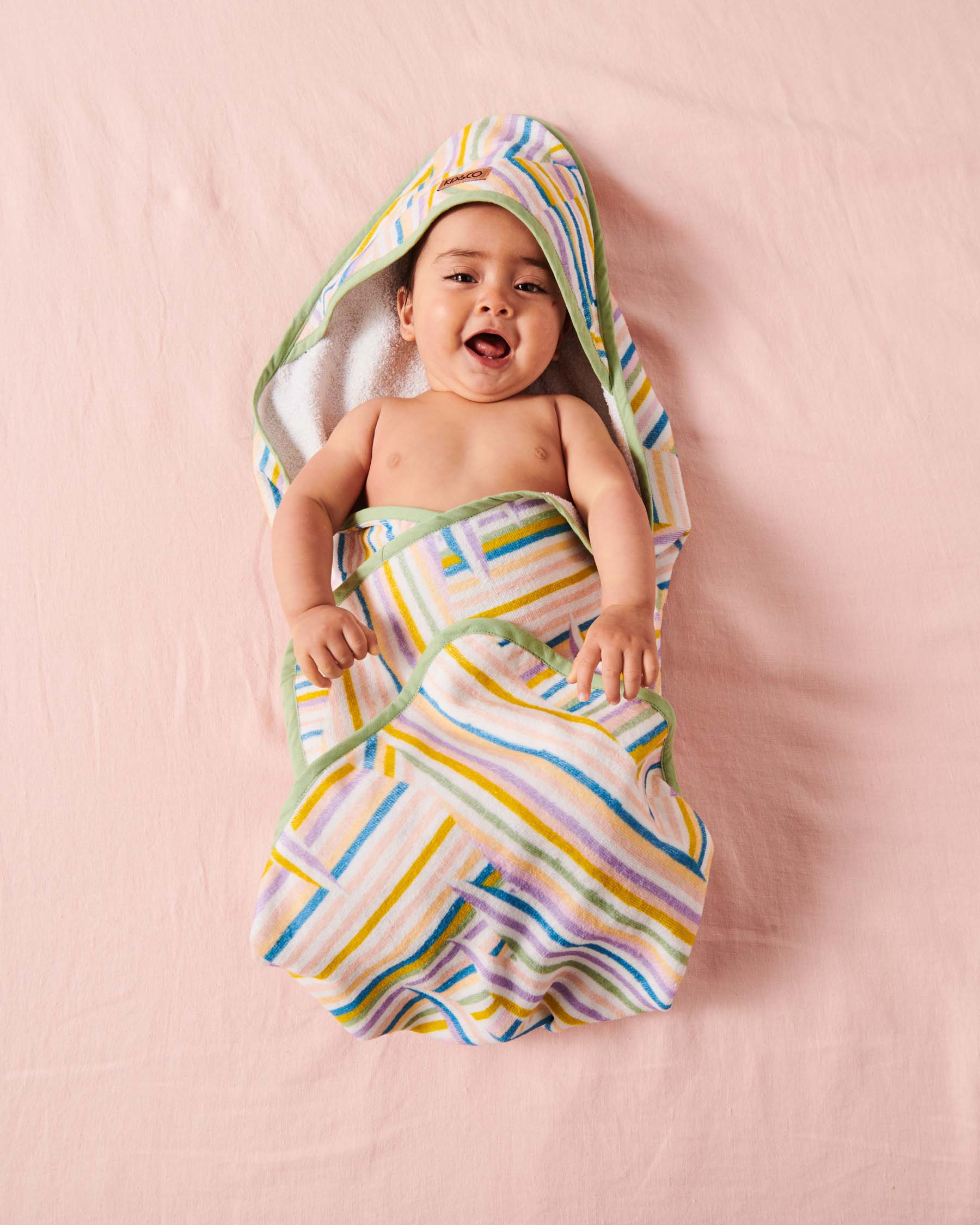 https://cdn.shopify.com/s/files/1/0231/5727/6752/products/kip-and-co-ss23-stripes-of-paros-terry-baby-towel-0.jpg?v=1692167941