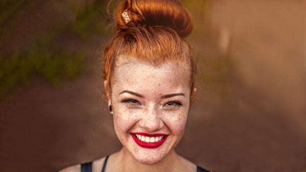 Girl with red hair smiling