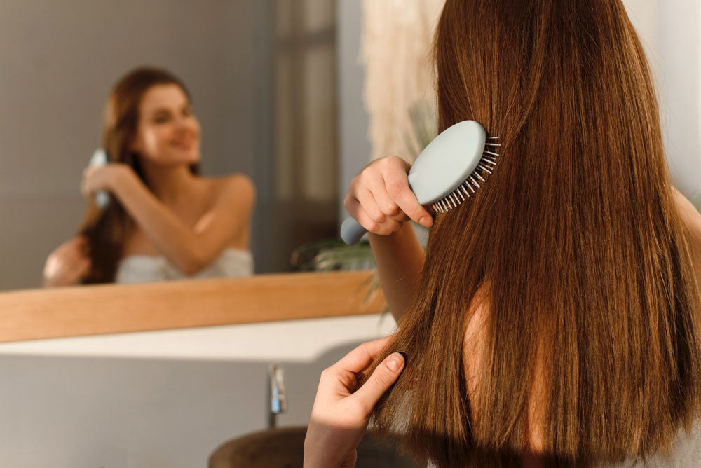 brushing hair mirror