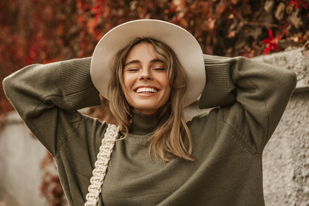 portrait smiling woman wearing hat