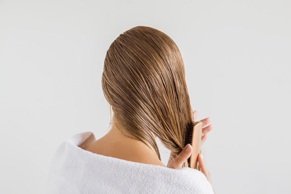 white towel comb brushing hair