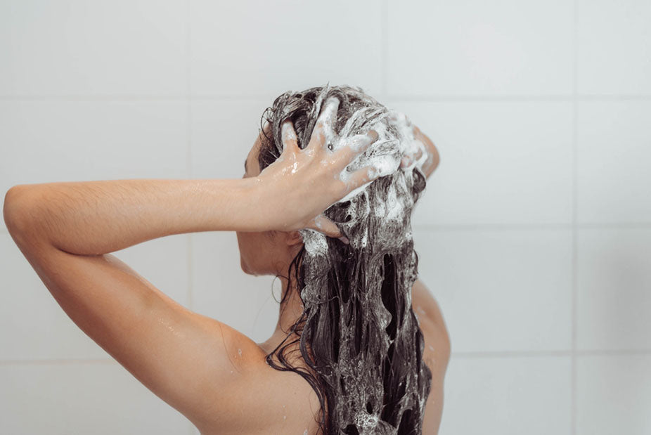 woman washing hair in shower